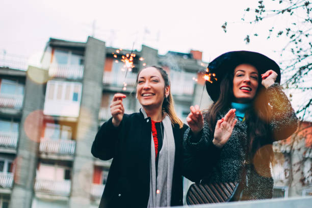 istock two women friends having fun together 900031116