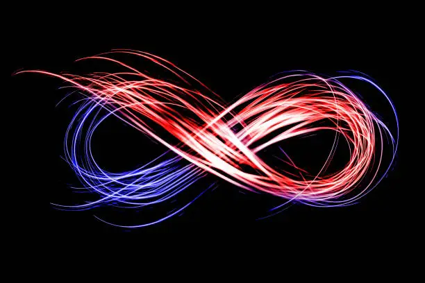 infinity sign created by red blue neon freeze light on a black background