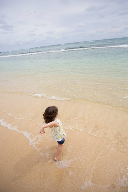 istock Child Playing on Beach in Oahu Hawaii 900043882