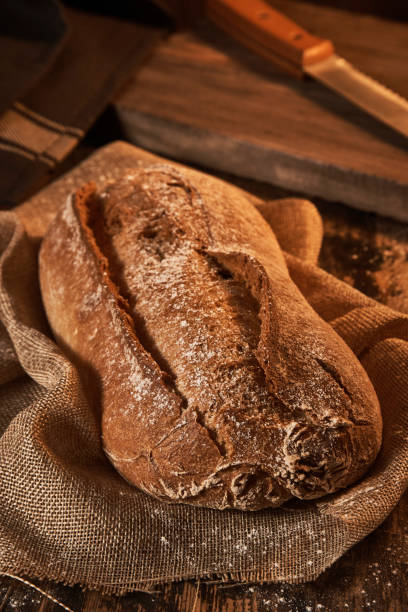 istock Freshly made loaf of bread on canvas 900048670