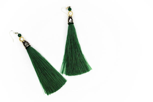 istock Green earrings on white background. 900049024