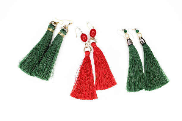 istock Beautiful earrings on white in different colors. 900049236