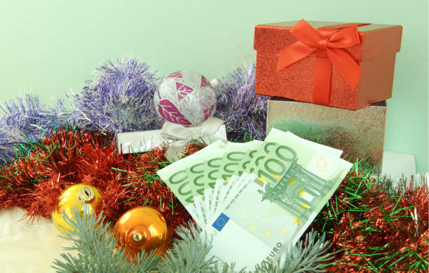 gift with money close up from gift with money for christmas euro bill in a christmas ornament stock pictures, royalty-free photos & images