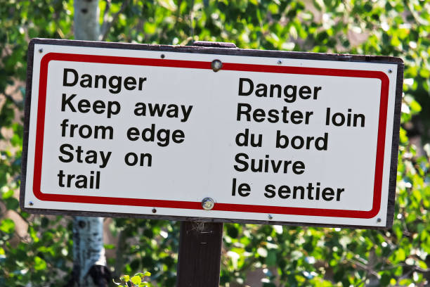 istock Danger keep away from edge stay on trail sign 900071264