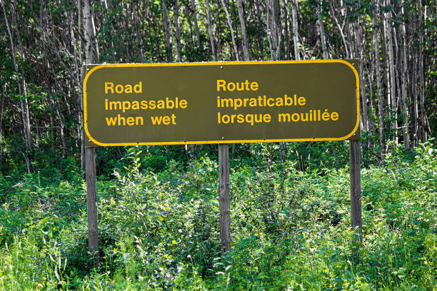 istock A bilingual road impassable when wet sign 900071298