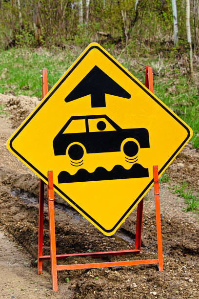 istock Closeup of a bumpy road ahead sign 900071328