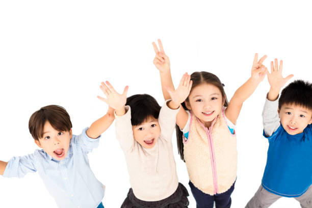 istock Group of happy children with hands up 900075796