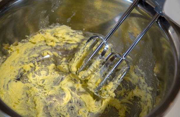 istock stirring egg yolk and butter 900089914