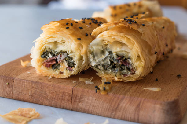 istock Turkish Borek with Spinach and Pastrami or Pastirma. 900096370
