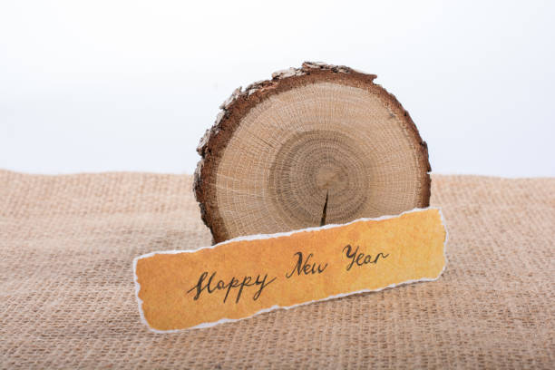 istock Happy new year written on a torn paper 900097512