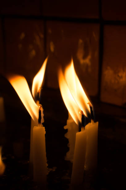 istock Burning candles give light in the dark 900097544