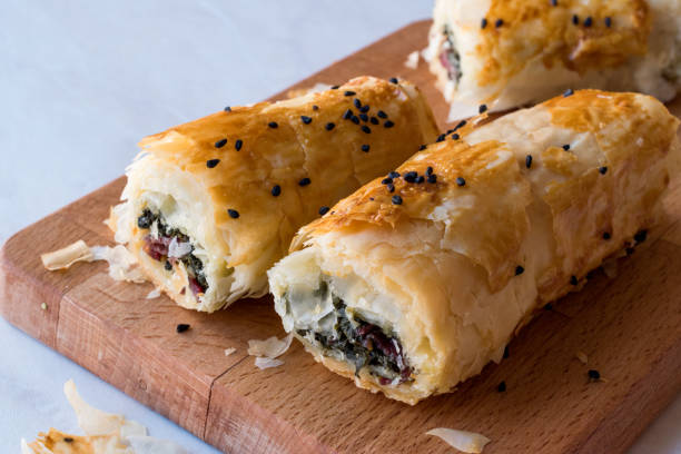 istock Turkish Borek with Spinach and Pastrami or Pastirma. 900104416