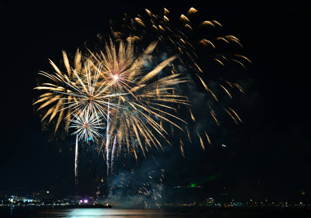 Multicolor fireworks night scene Multicolor fireworks night scene, closeup with pattaya cityscape sea beach view, Thailand.Multicolor fireworks night scene, closeup with pattaya cityscape sea beach view, Thailand. phuket beach party stock pictures, royalty-free photos & images