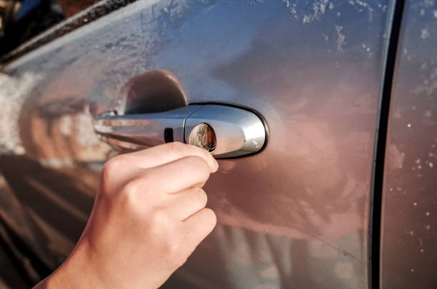 istock Open a car door with coins 900107346