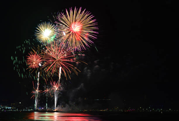 Multicolor fireworks night scene Multicolor fireworks night scene, closeup with pattaya cityscape sea beach view, Thailand.Multicolor fireworks night scene, closeup with pattaya cityscape sea beach view, Thailand. phuket beach party stock pictures, royalty-free photos & images