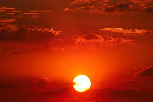 cloudy sky and bright sunrise over the horizon