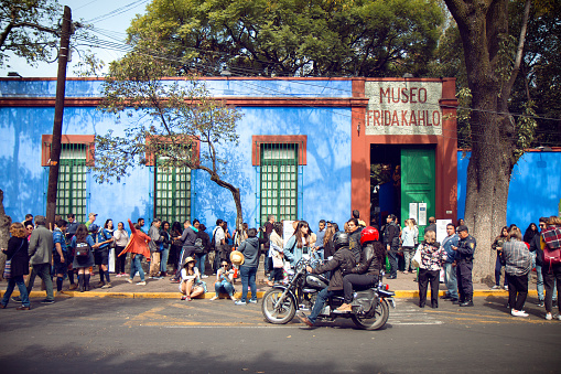Mexico City, Mexico - December 2, 2017: Visitors wait to enter Frida Kahlo’s birthplace and residence for most of her life, also known as the Blue House, which is now a museum in Coyoacan, Mexico City.