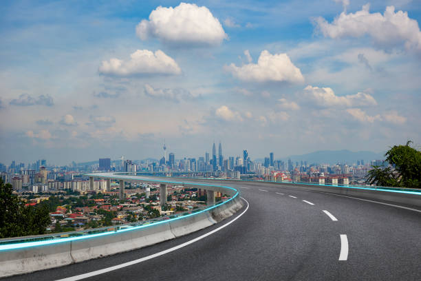 istock Highway overpass with modern city background . Noon scene . 900114248