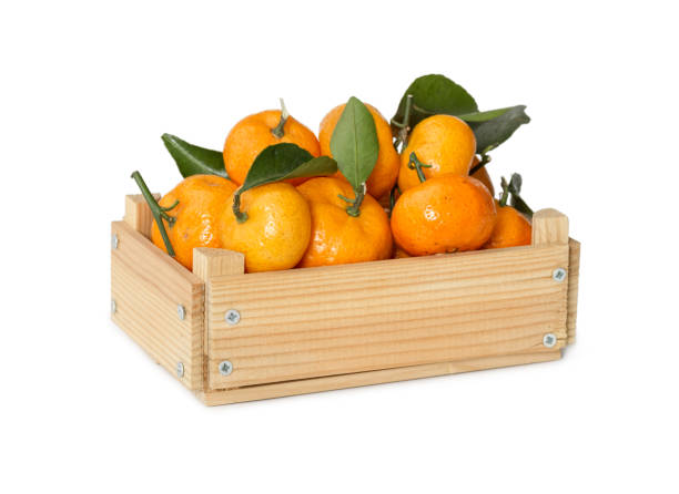 istock Wooden box with fresh mandarins 900114704