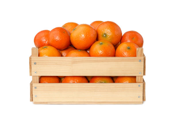 istock Fresh mandarins in wooden box 900114776
