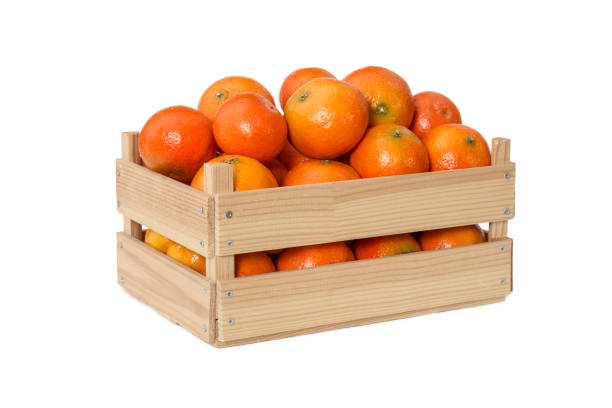 istock Fresh mandarins in wooden box 900114778