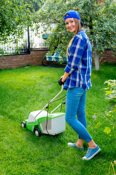 istock Young woman gardening 900119428