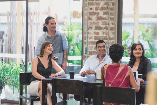 istock Diverse group of friends at cafe 900119598