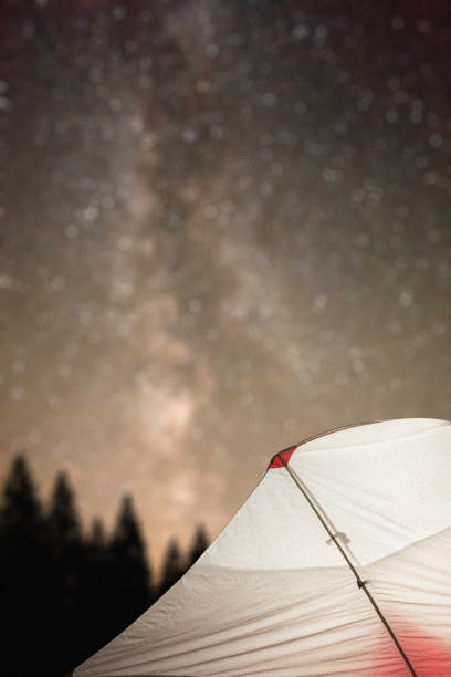 istock Tourist tent glowing under the stellar sky 900119938