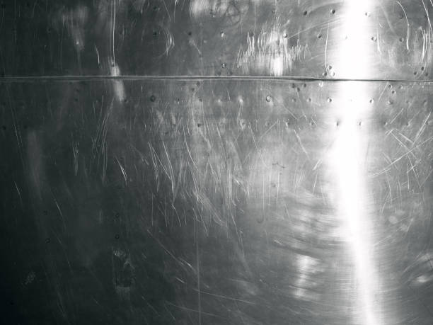 istock Shiny scratched metal surface close up 900123562
