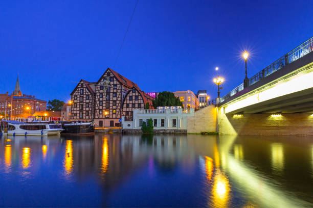 Bridge in Bydgoszcz city over Brda river at night, Poland