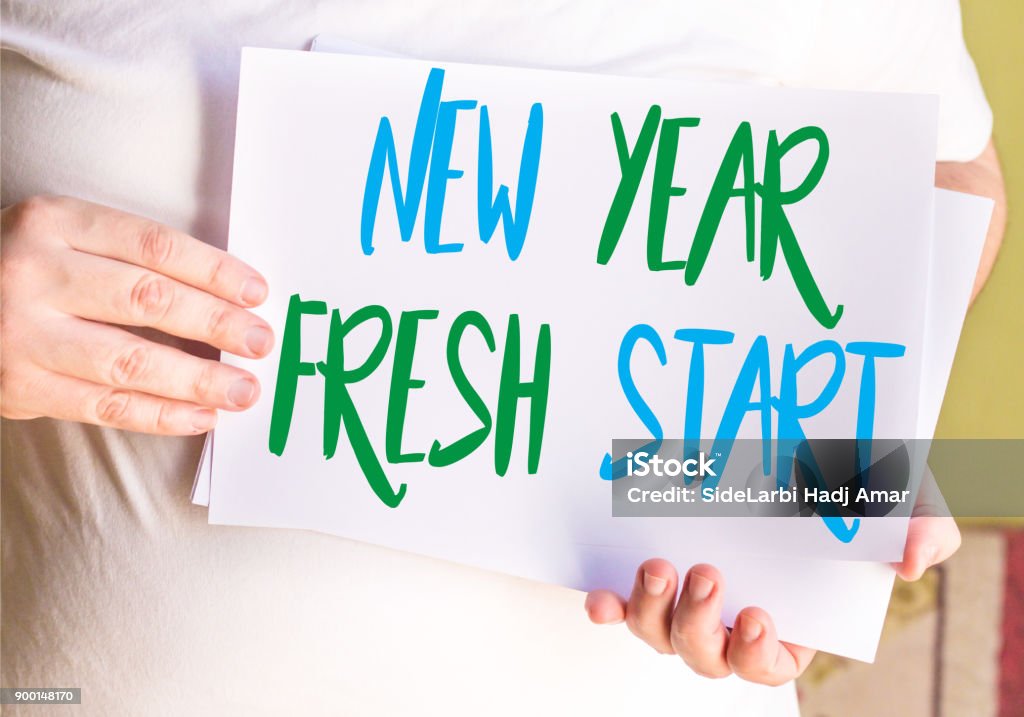 New Year Fresh Start on white paper Adult Stock Photo