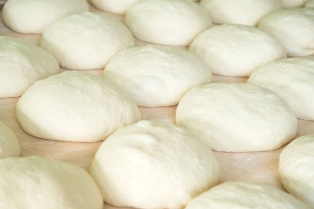 istock Fresh dough on the wooden board, pizza, Georgian bread 900165264