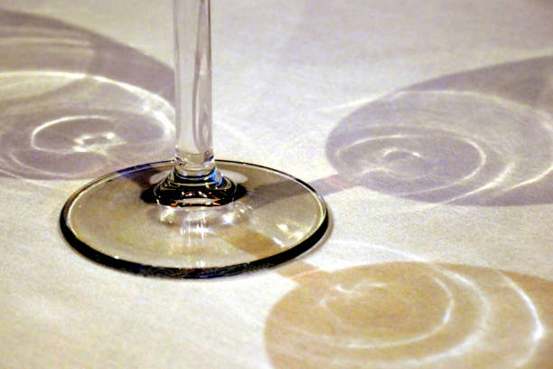 Soft light reflecting through transparent glass dishes..