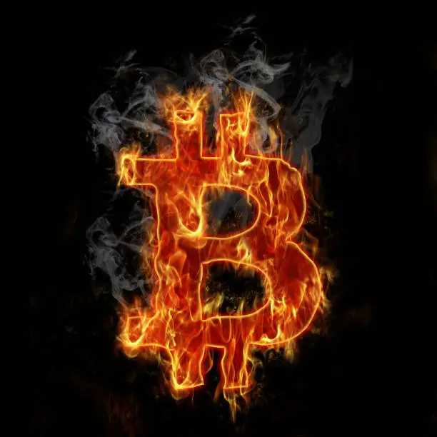 Photo of Burning bitcoin symbol