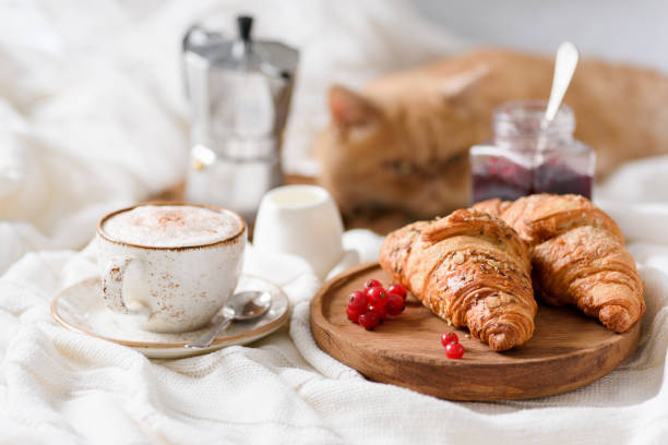 istock Breakfast in bed with coffee, croissants and jam 900171878