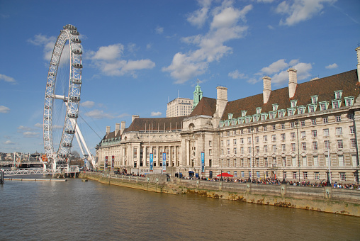 London, United Kingdom - April 11, 2015: County Hall, River Thames and London Eye