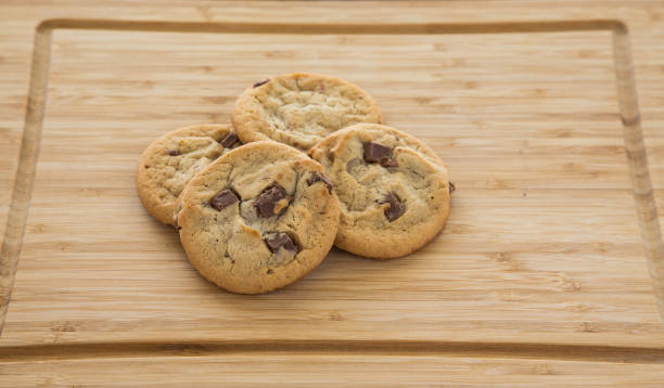 istock Fresh Chocolate Chip Cookies on Cutting Board 900177472