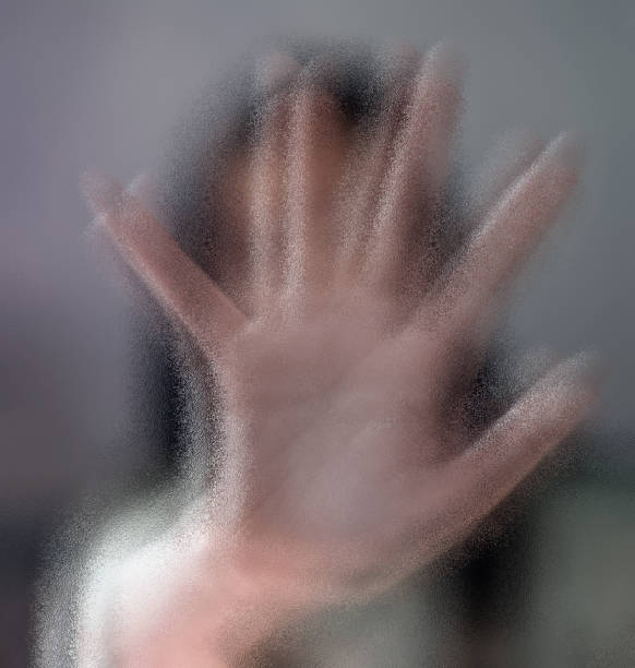 istock A hand blocking face shot with frosted glass effect. 900180598