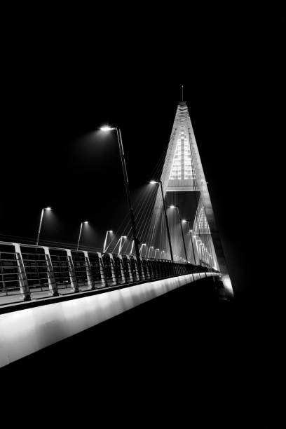 istock Black and White Landscape with bridge into the endless dark. 900180958