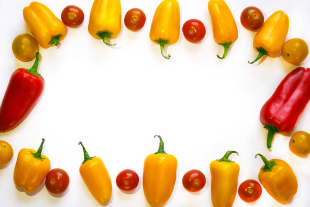 istock yellow and red peppers and red cherry tomatoes frame 900184134