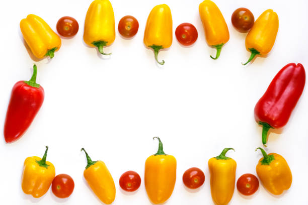 istock yellow and red peppers and red cherry tomatoes frame 900184278