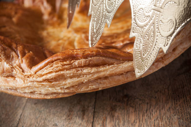 istock epiphany cake with golden crown on wooden table background 900184536