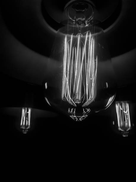 istock Vintage light bulb with tungsten filament. 900188258