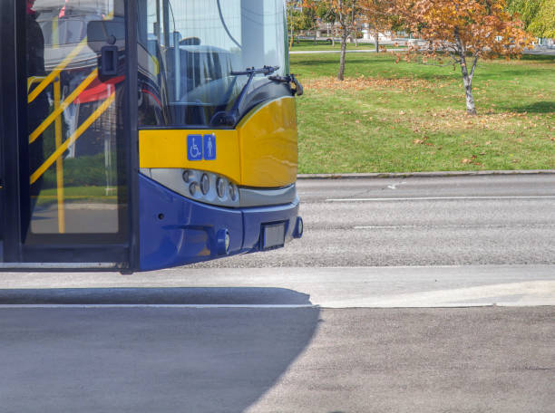 istock Bus front part on bus stop in the city ready to take passengers 900188452