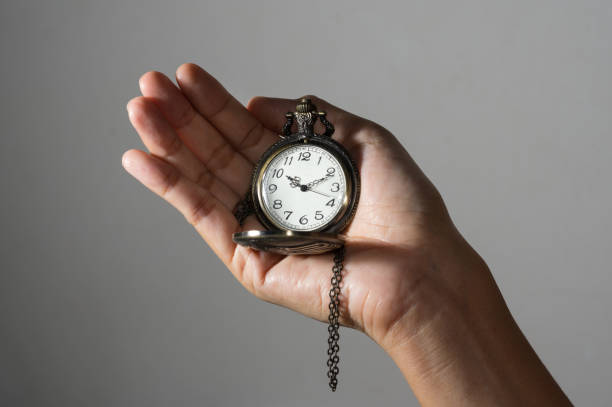 istock Pocket watch in girl hand. 900192962