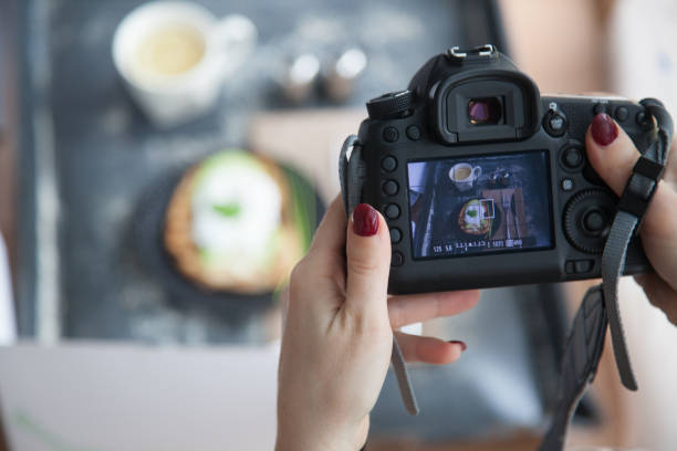 istock Female hands taking picture of breakfast table set up 900195570