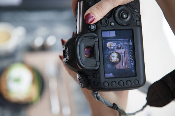 istock Female hands taking picture of breakfast table set up 900195690