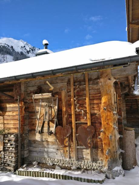 istock wooden hut in the alps in the mountains with snow 900195708