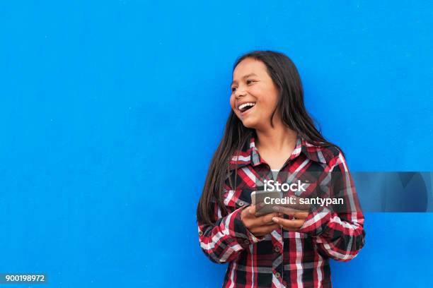 Portrait Of Beautiful Latino Girl Using The Mobile In The Street Stock Photo - Download Image Now