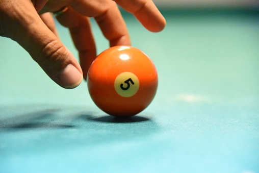 Number 5 orange billiard ball